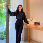 Tailored silk pants with high-rise waist and sleek straight-leg silhouette for elevated styling